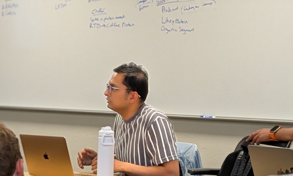 Ankit Singh leading a product strategy session at a whiteboard